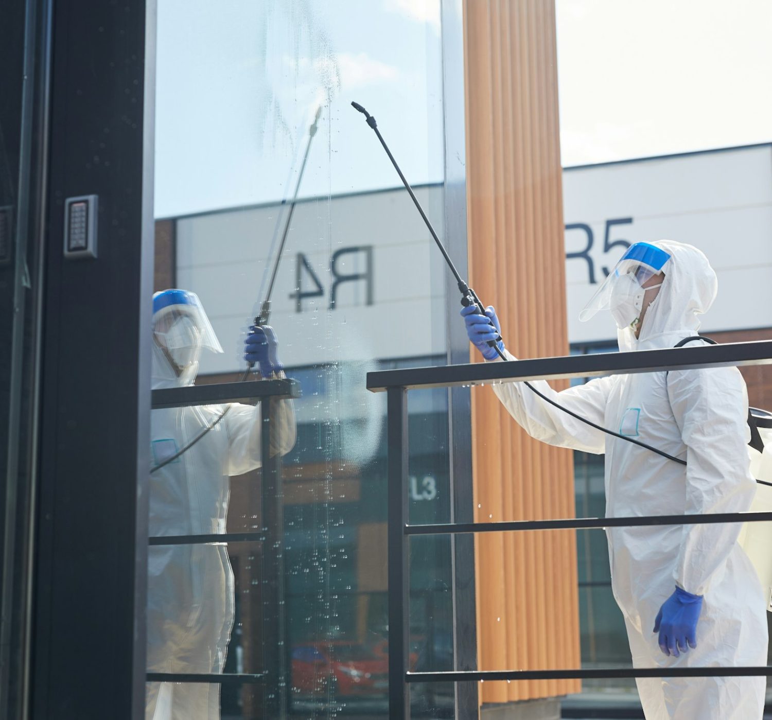 Worker Cleaning Glass Window